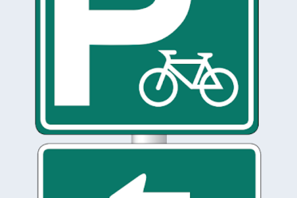 Bike parking signage. A large "P" with a bike. Below is an arrow pointing left.