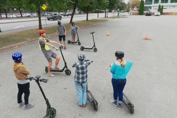 A class of HUB Students learn e-scooter skills from a HUB instructor