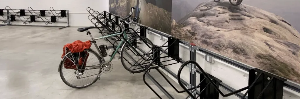 A bike is parked inside a bike room.